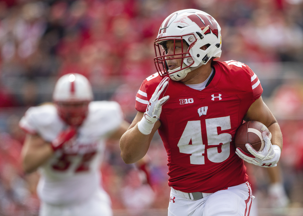 Ingold running with football