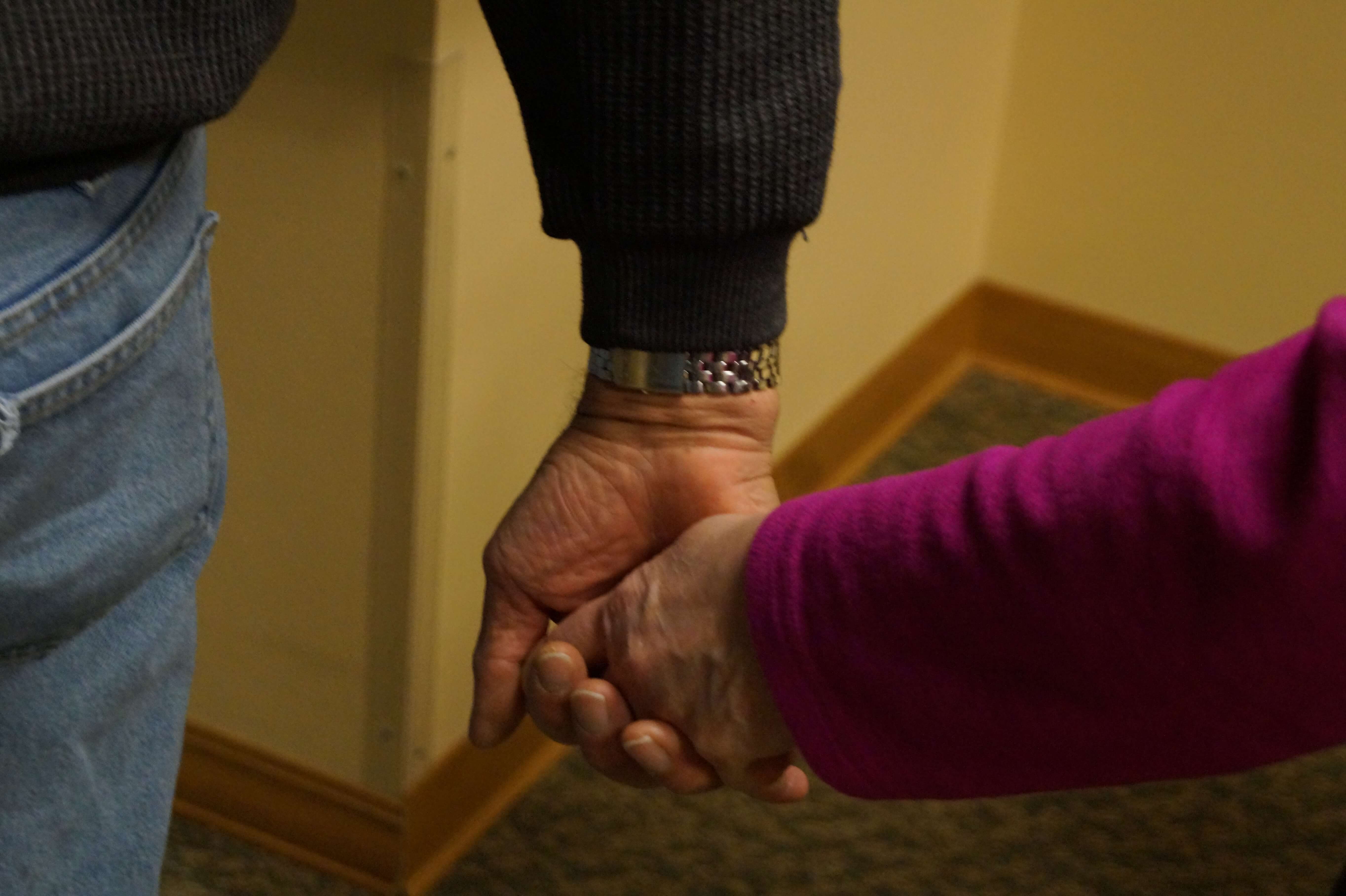 Couple holding hands