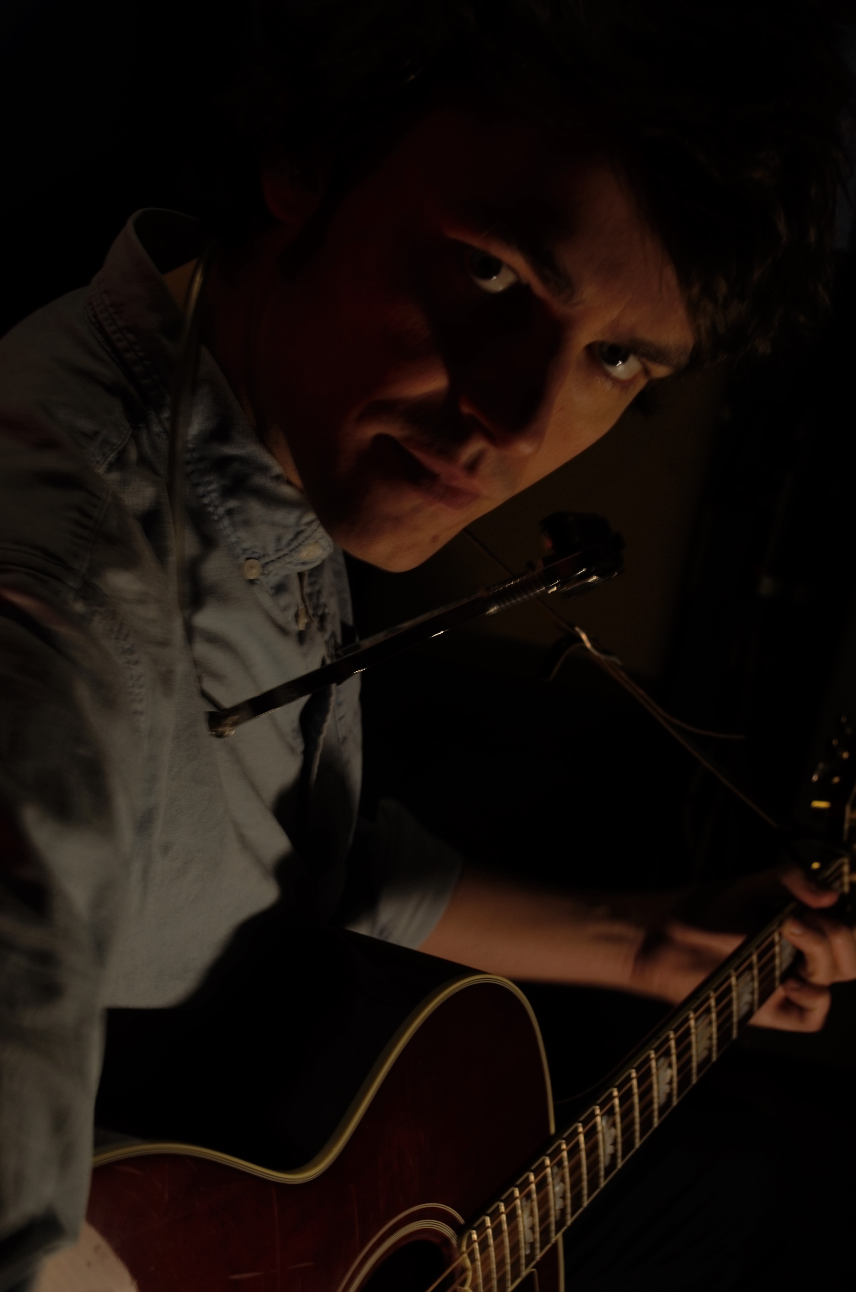 Schoepp holding his guitar