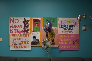 Signs hang on the wall at Centro Hispano