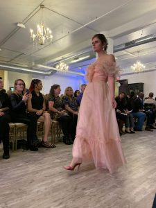 A model walks down the runway at Milwaukee fashion week